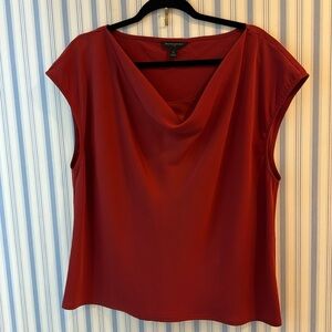 Banana republic silk like blouse in rust color. Neckline lays very beautifully.